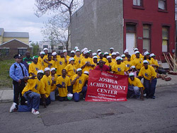 Mayorial Candidate, Micheal Nutter lends a broom to the Merion Avenue